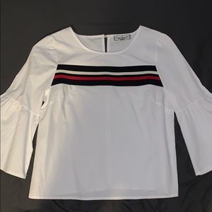 White blouse with a blue and red stripe